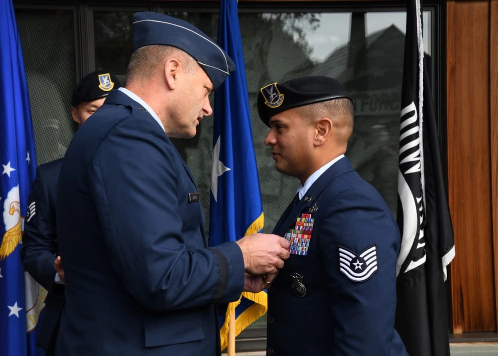 Brigadier General Timothy J. LaBarge, New York National Guard Director of Joint Staff, presents Technical Sergeant Flavio Martinez with the Pruple Heart at a ceremony October 14, 2018 at the National Purple Heart Hall of Honor, New Windsor, NY.