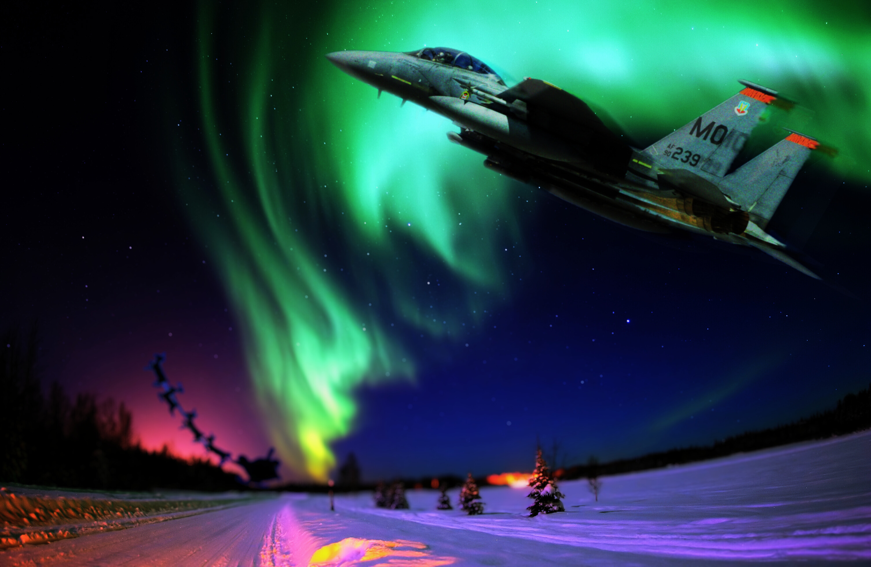 MOUNTAIN HOME AIR FORCE BASE, Idaho – An F-15E Strike Eagle rushes to assist Santa Claus and serves as his wingman as he delivers presents around the world. Flying a ‘sleigh’ powered by two Pratt and Whitney engines and capable of flying at speeds in excess of 1,800 mph, Maj. Kristin Wehle, 366th Fighter Wing F-15E pilot, believes she and other Air Combat Command pilots could be Santa’s perfect wingman, she said. (U.S. Air Force photo illustration/Master Sgt. Kevin Wallace/RELEASED)