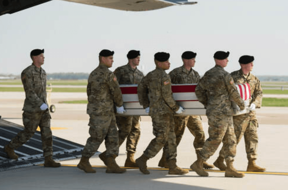 Soldiers at Dover Air Force Base, Delaware, transfer the remains of SPC Gabriel Conde of Loveland, Colorado.